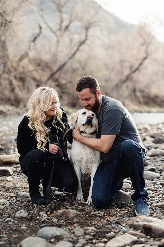 A couple taking engagement photos with their dog in Golden, Colorado