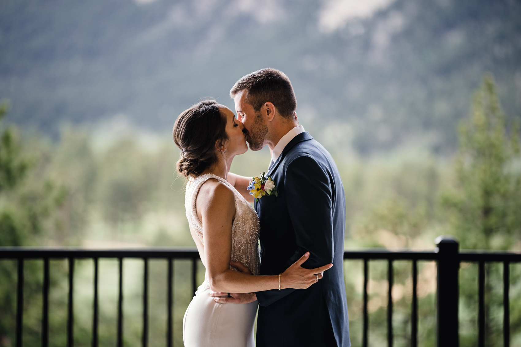 couple getting married during their ceremony at grand lake lodge for a grand lake Colorado wedding